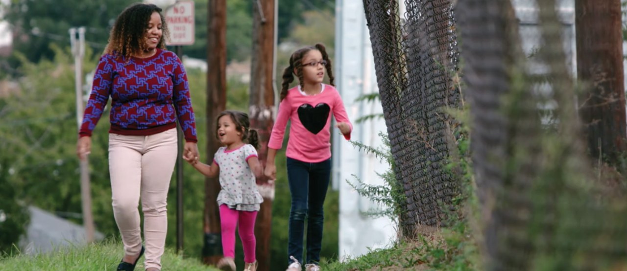  Elaine, Penelope and Olivia take a walk in their community. 
